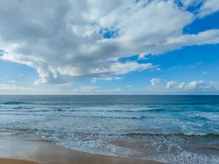 Morning views at the seaside with clouds and a blue sky