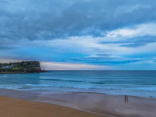 Sunrise at the Seaside with Cloud Covered Sky