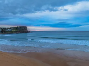 Sunrise at the Seaside with Cloud Covered Sky