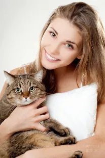 Girl with cat and a white pillow